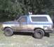 after i put 33"s on it and 15x10" rims beleve it or not i have less tha 50buck in all 5 tires and rims (perks of working at a junk yard at the time) also u can see the light bar i built out of an old bumper and a fence post